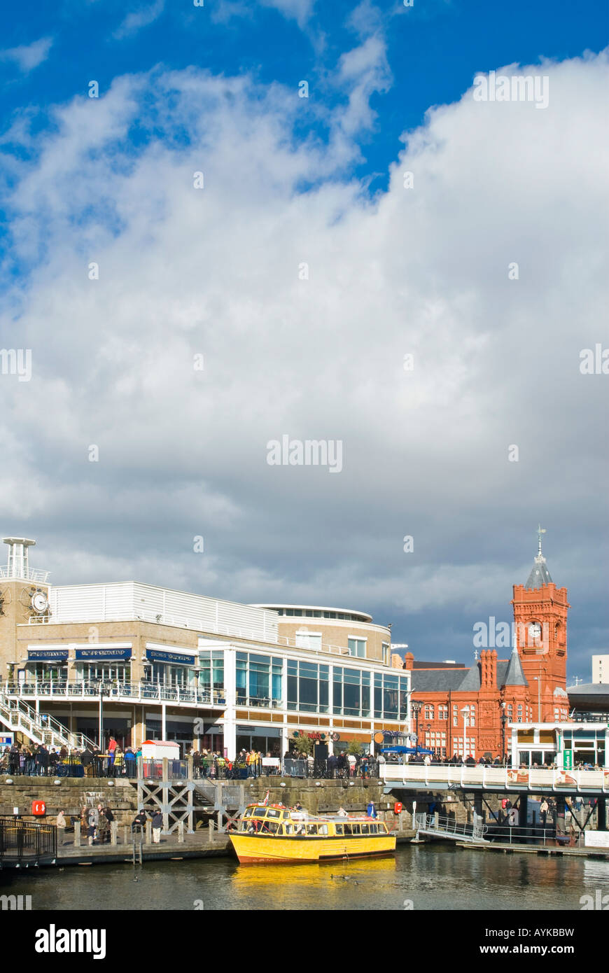Vertical view across Mermaid Quay towards the Pierhead Building at the Cardiff Bay Development on a bright sunny day Stock Photo