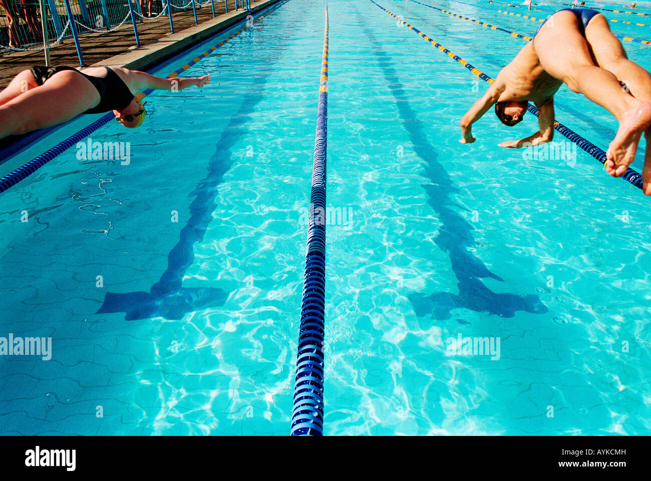 Female swimmers during start of race hires stock photography and