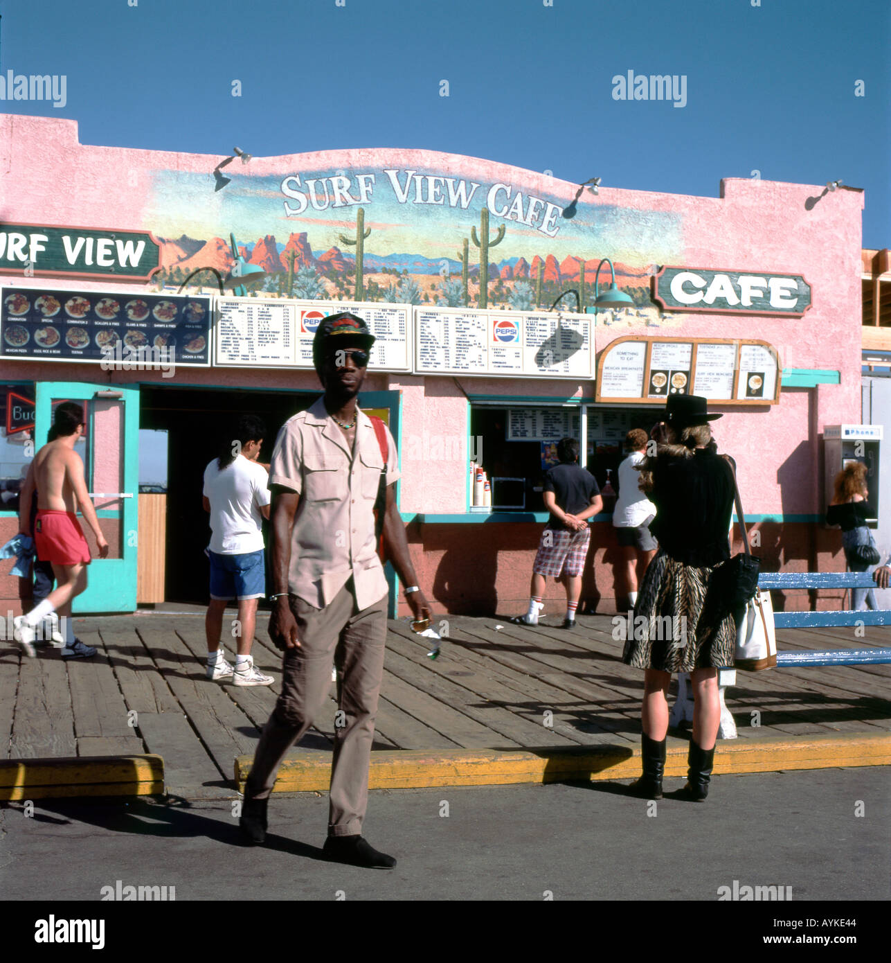 Archival photo of people tourists on the boardwalk outside the Surf View Cafe Santa Monica Pier
