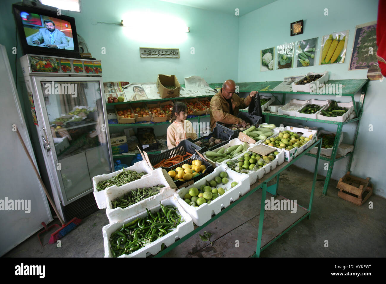 An Iraqi girl in a vegetable shop in Amman. Many Iraqi refugees have settled in Amman Jordan because of the ongoing violence in Stock Photo