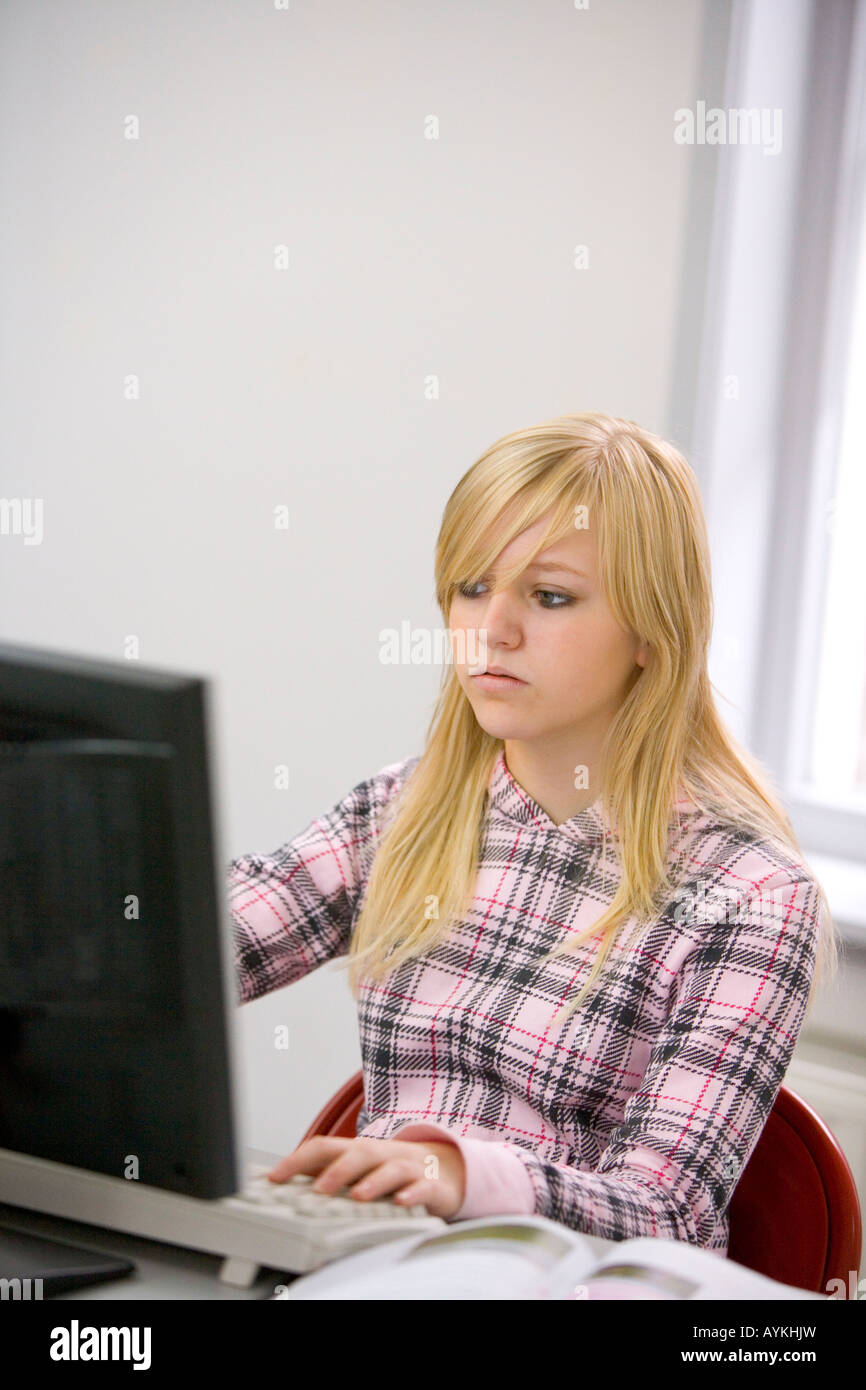 Teenage girl behind a computer Stock Photo - Alamy