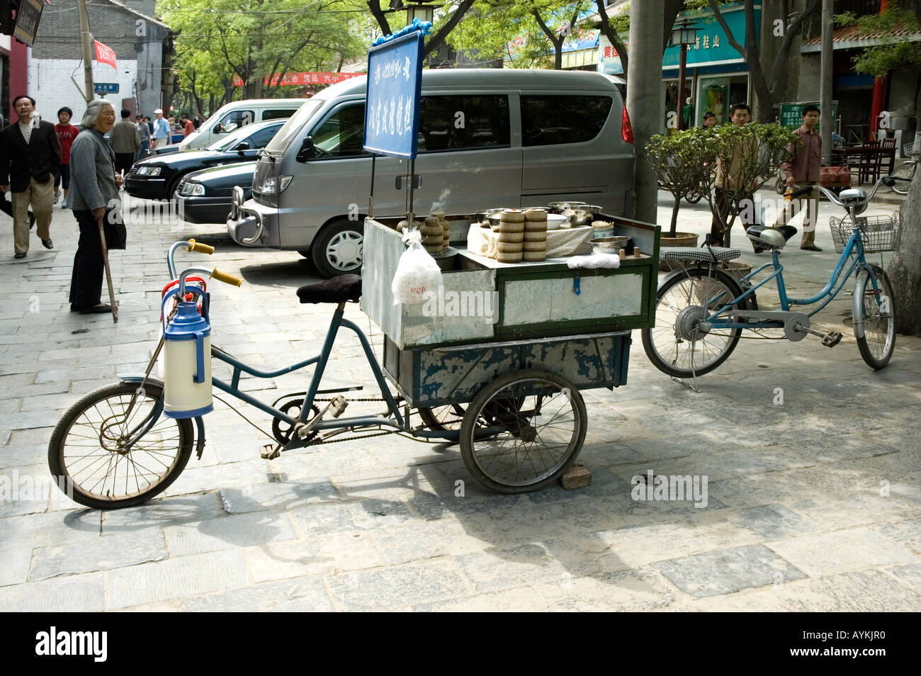 Tricycle carrier from which chinese food is being sdisplayed and sold Xian Stock Photo Alamy
