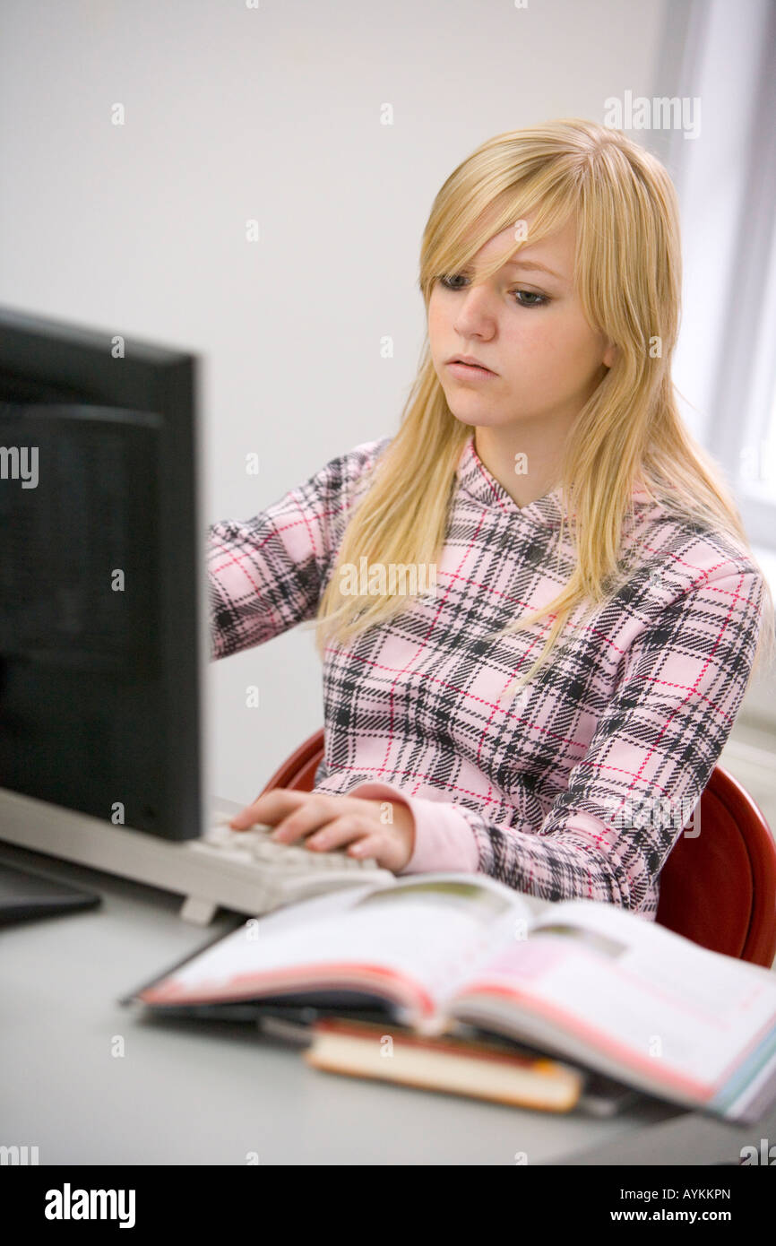 Teenage girl behind a computer Stock Photo - Alamy