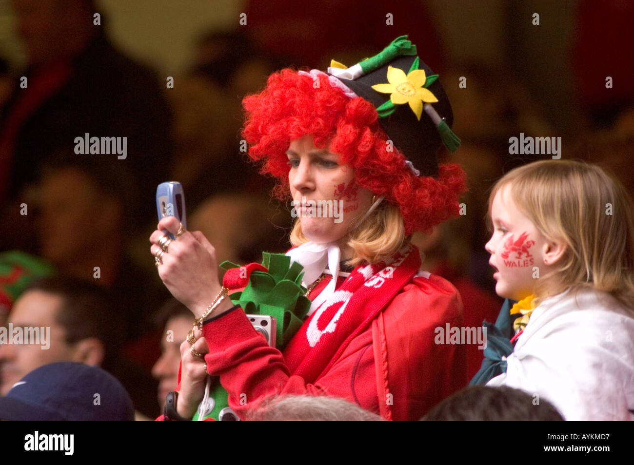 Female Spectator uses her mobile phone camera at a Welsh Rugby ...