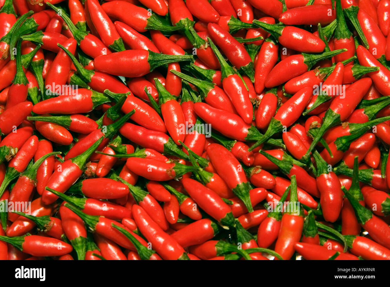 One red and many green peppers hi-res stock photography and images - Alamy