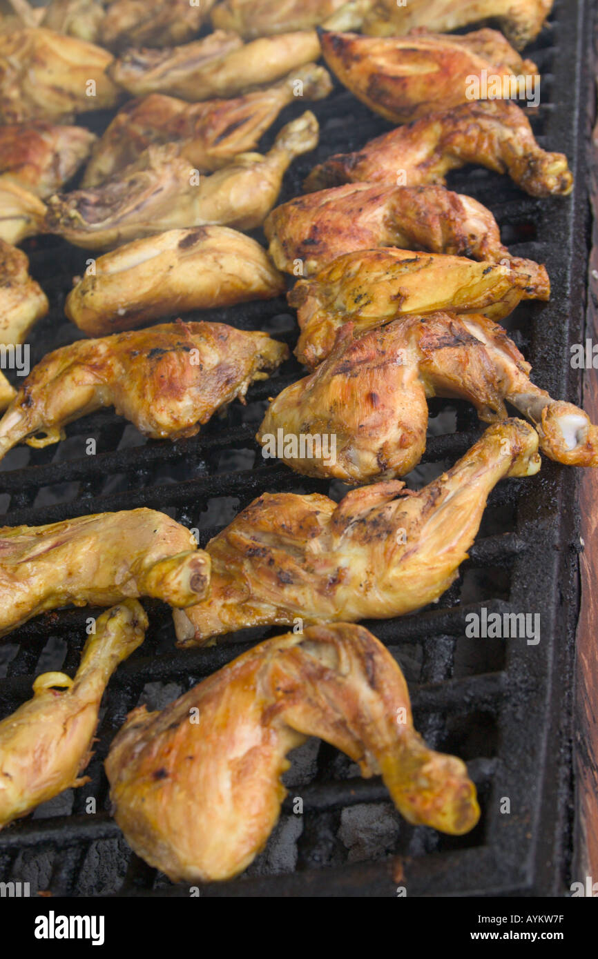 chicken drumstick being roasted on a grill Stock Photo Alamy