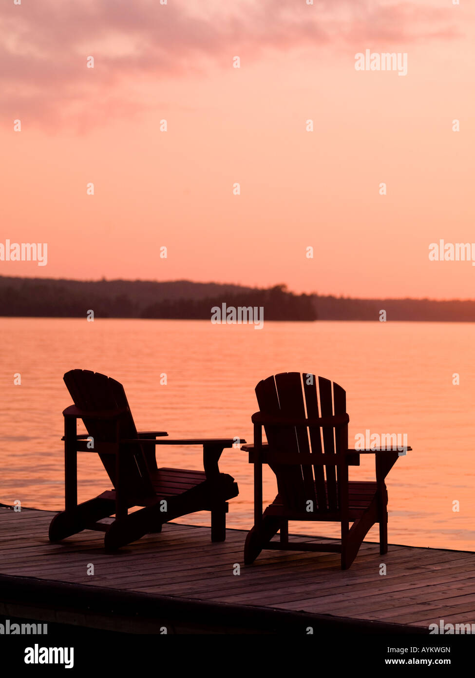 Lake of the Woods, Ontario, Canada, Adirondack chairs on a dock Stock ...