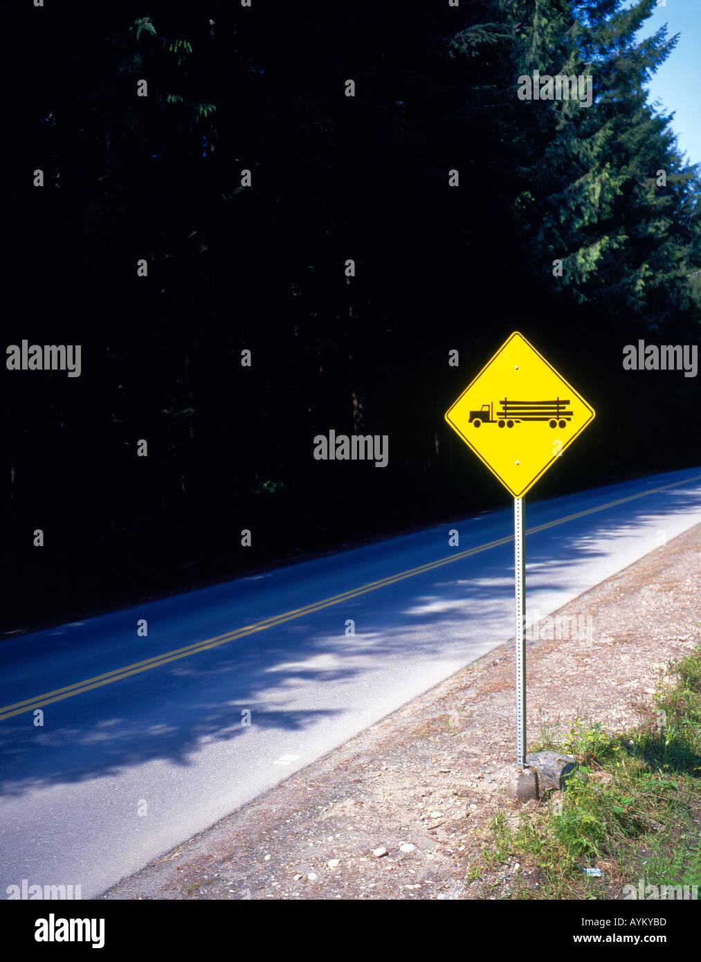 logging truck, traffic sign, Canada. Photo by Willy Matheisl Stock Photo