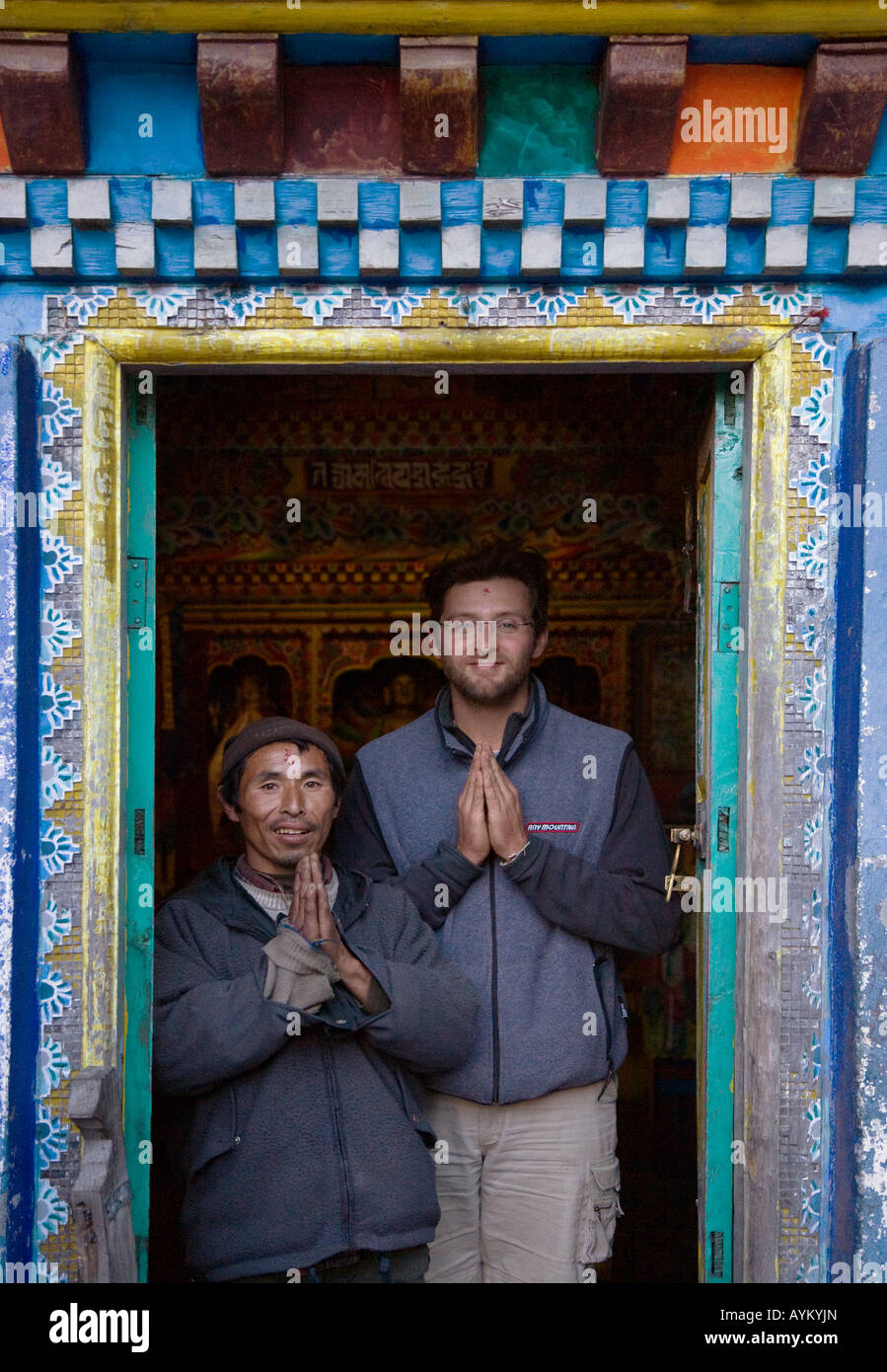 BODHI GARRETT and a devout BUDDHIST in the TIBETAN BUDDHIST TEMPLE in the village of KOTO on the ANNAPURNA CIRCUIT NEPAL MR Stock Photo