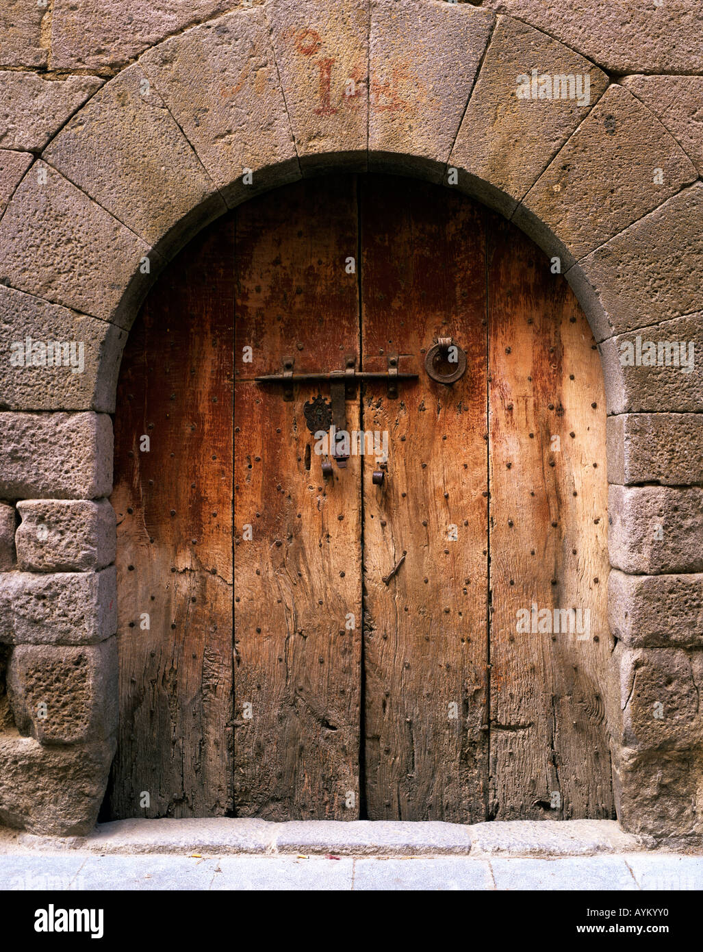 A large gateway or doors with heavy duty locks fitted for maxi,um