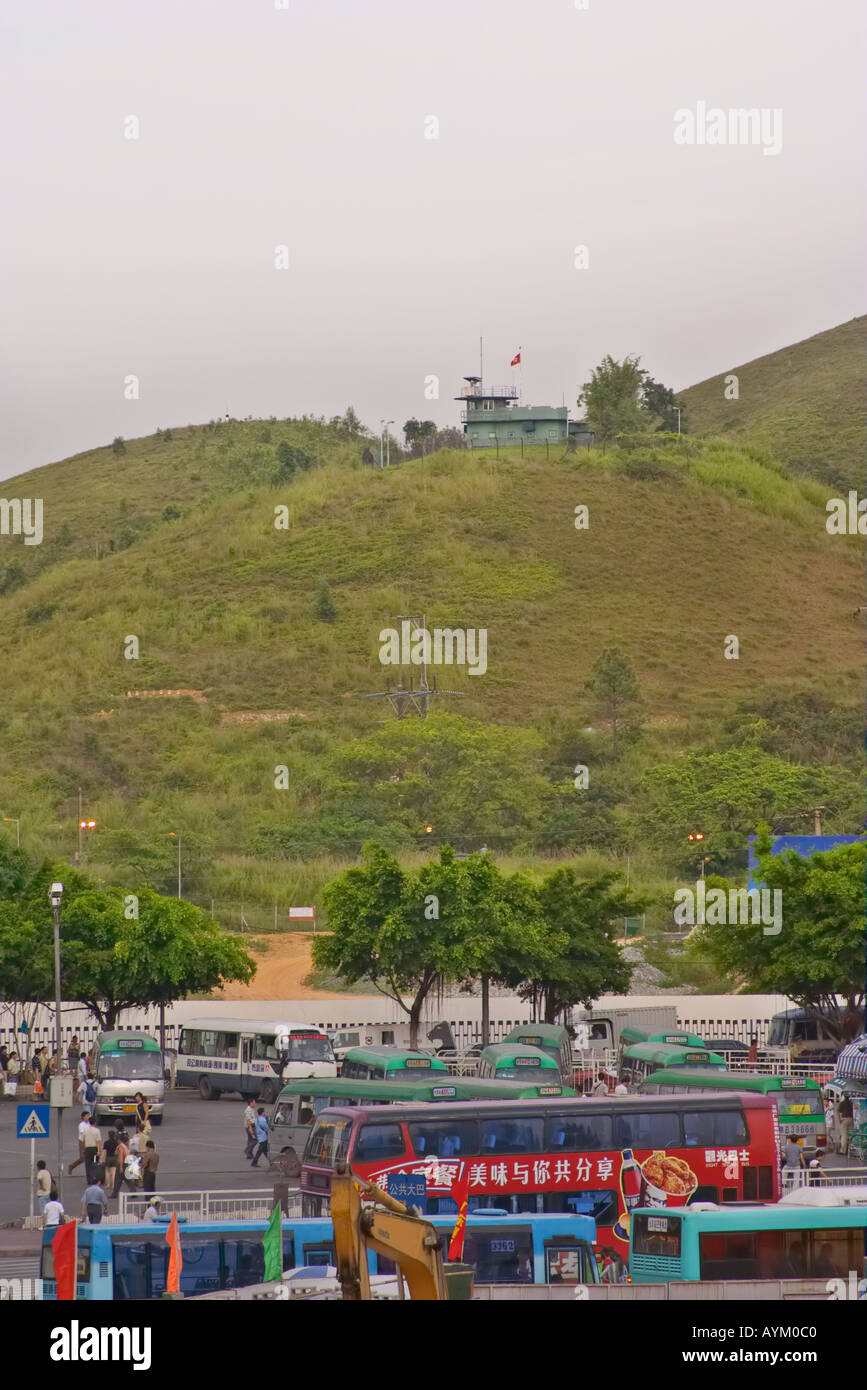 China border guard post with a foreground of a busy parking lot, Hong Kong border, Shenzhen, People's Republic of China Stock Photo