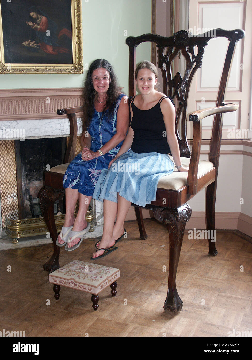 Sitting in giant chair on show at Paxton House Berwickshire Scotland a former Alice in Wonderland film prop Stock Photo