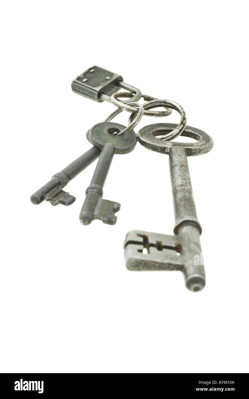 Old keys with mini padlock on white background Stock Photo - Alamy