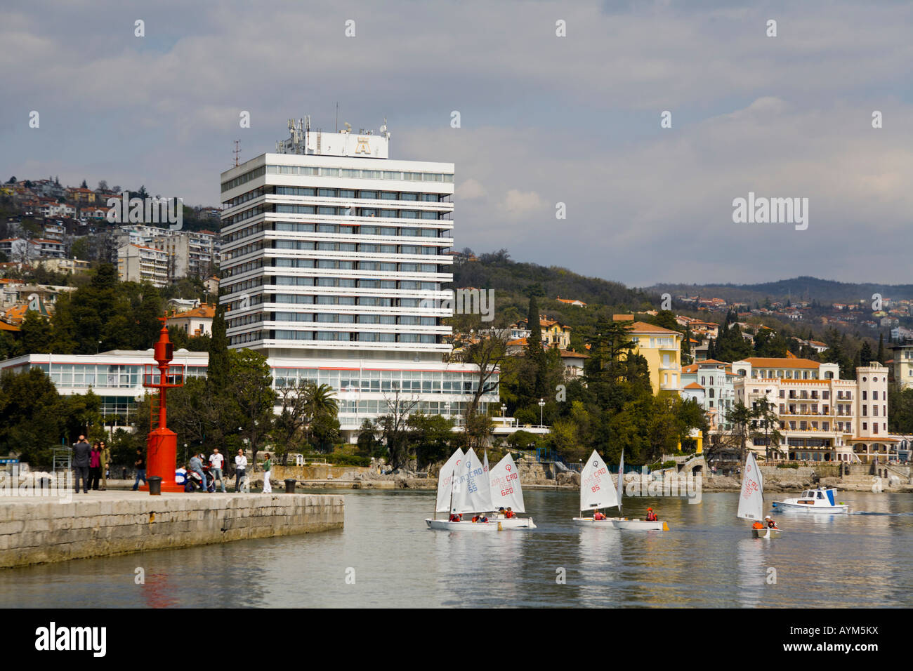 Hotel Ambasador, Opatija in Croatia, small-boat regatta finale in foreground Stock Photo