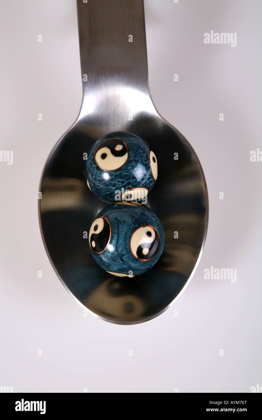 Yin and Yang Balls in a spoon Stock Photo