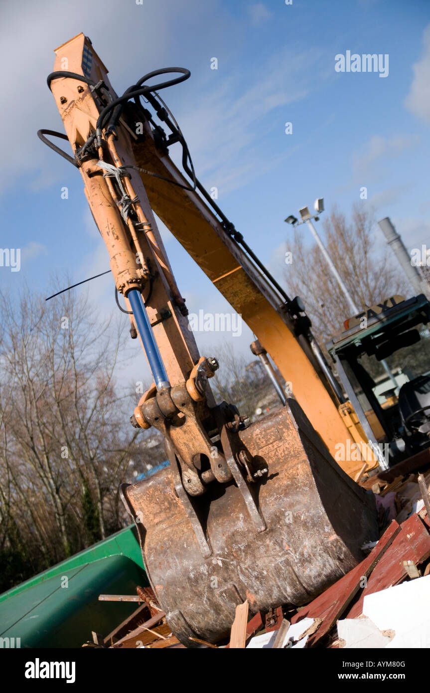 bull dozer 360 excatator bucket breaking down waste at a civic amenity site Stock Photo
