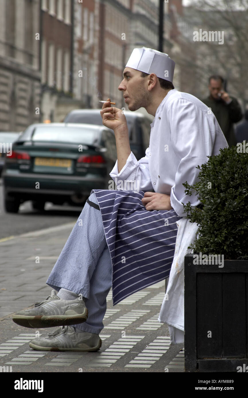Chef taking a rest break for a cigarette Mayfair London W1  Stock Photo
