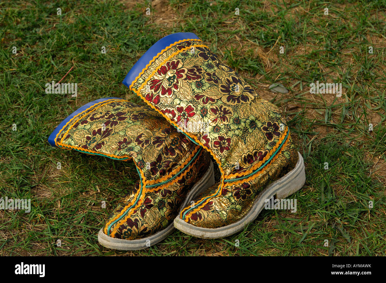 Decorated boots in the grass Ulaanbaatar Mongolia Stock Photo