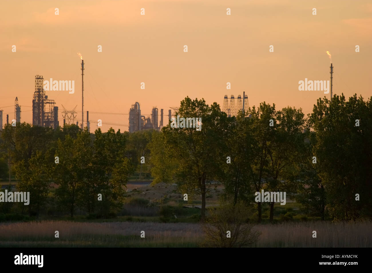 An oil refinery reflects the last sun of the day Stock Photo - Alamy