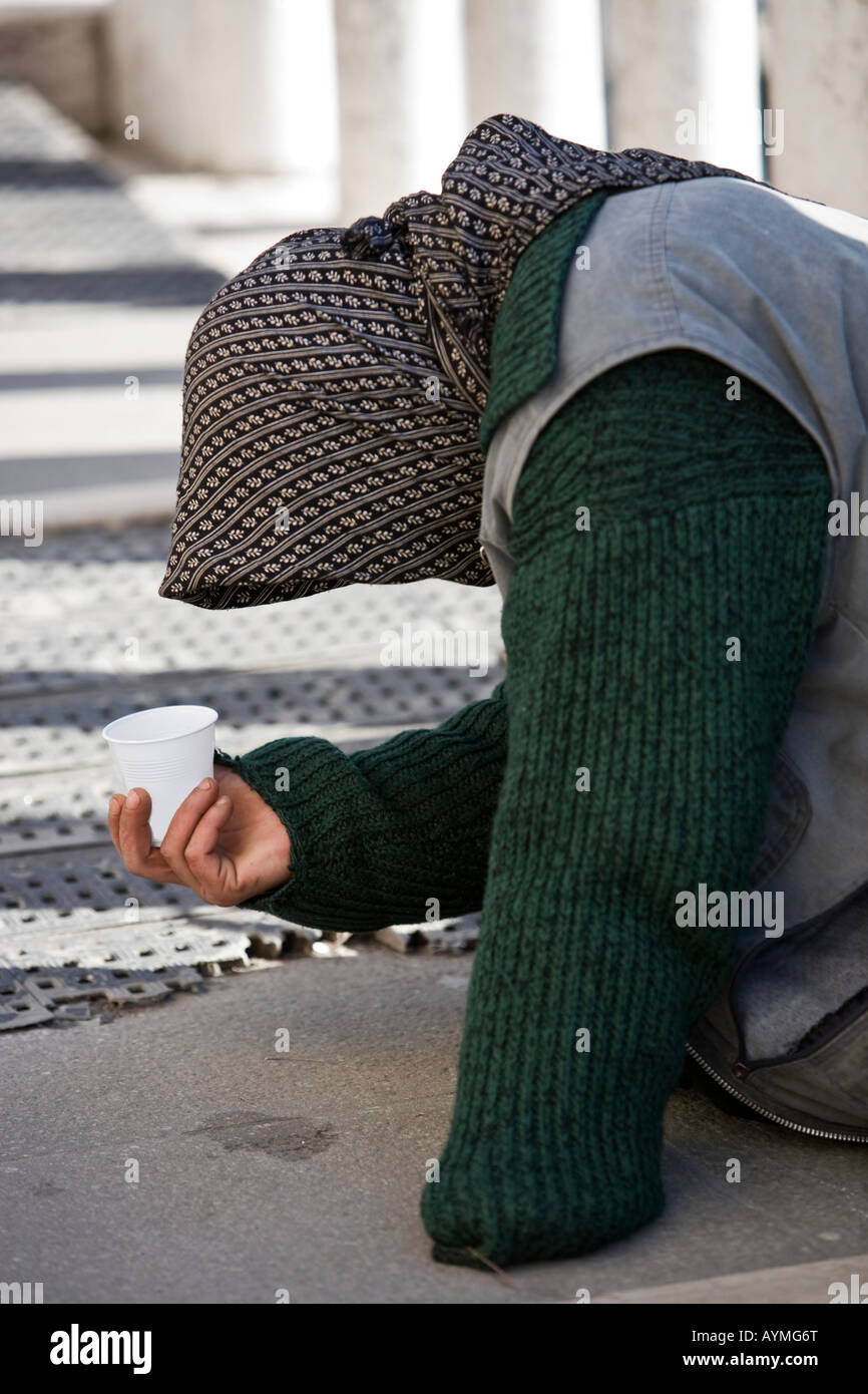 beggar in the beautiful city of venice in italy Stock Photo - Alamy