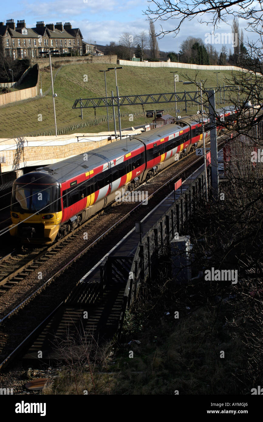 Elevated view of commuter train standing at Crossflatts station Stock