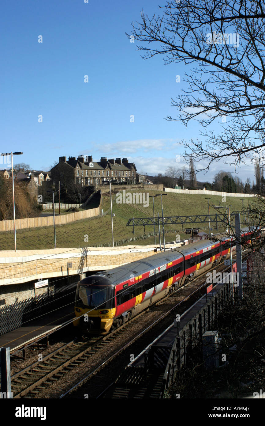 Elevated view of commuter train standing at Crossflatts station Stock