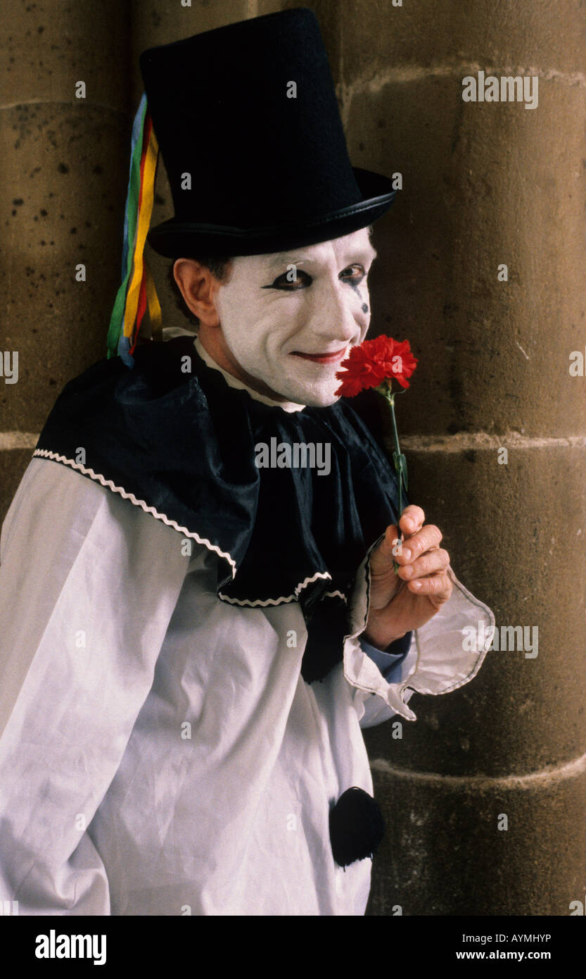 Pierrot clown with red carnation Stock Photo