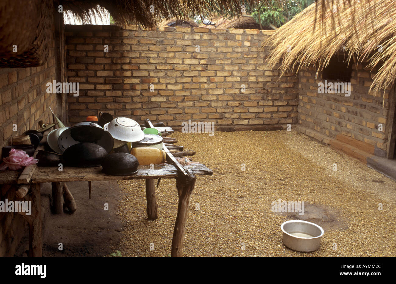 Typical courtyard of village house with cooking utensils - Nkhotakota, Lake Malawi, Malawi Stock Photo
