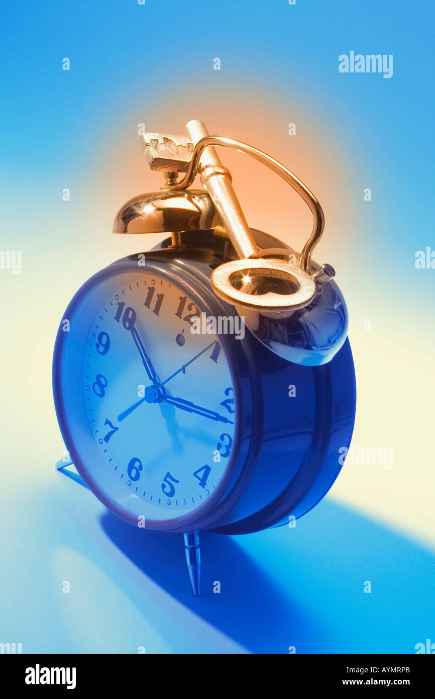 Skeleton Key on Alarm Clock Stock Photo