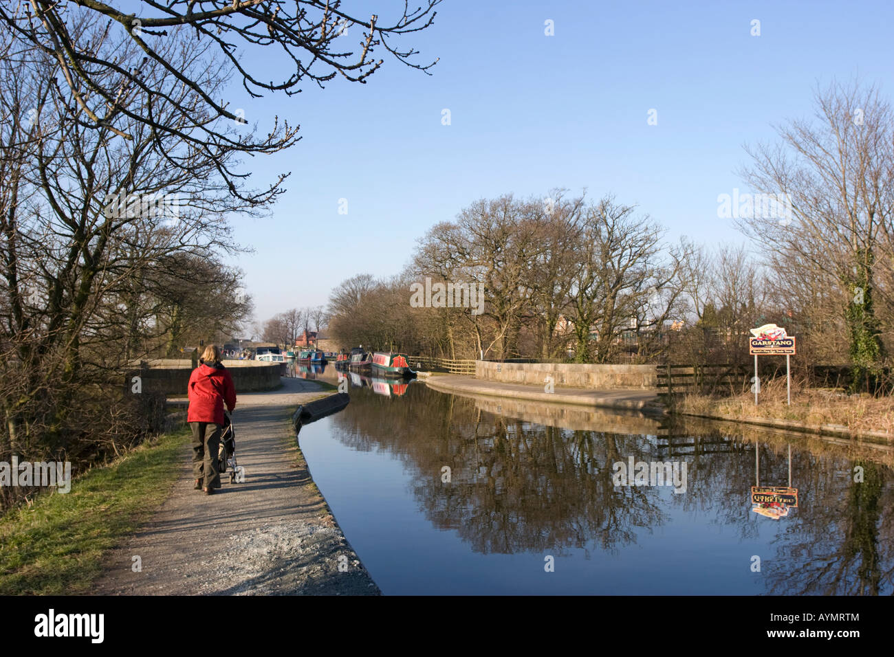 Woman walking by the Lancaster canal at Garstang Stock Photo