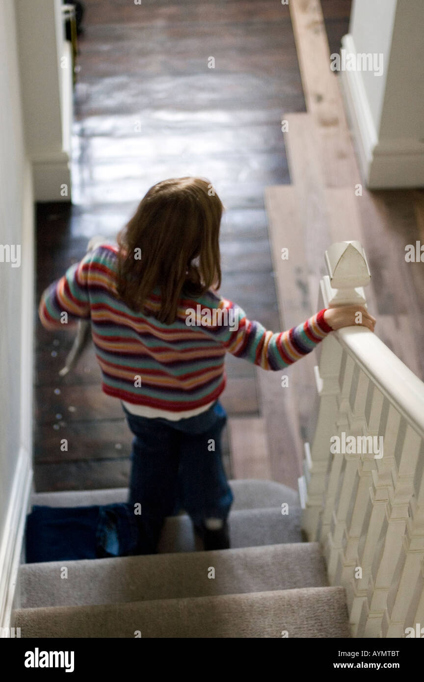 girl decending stairs Stock Photo - Alamy