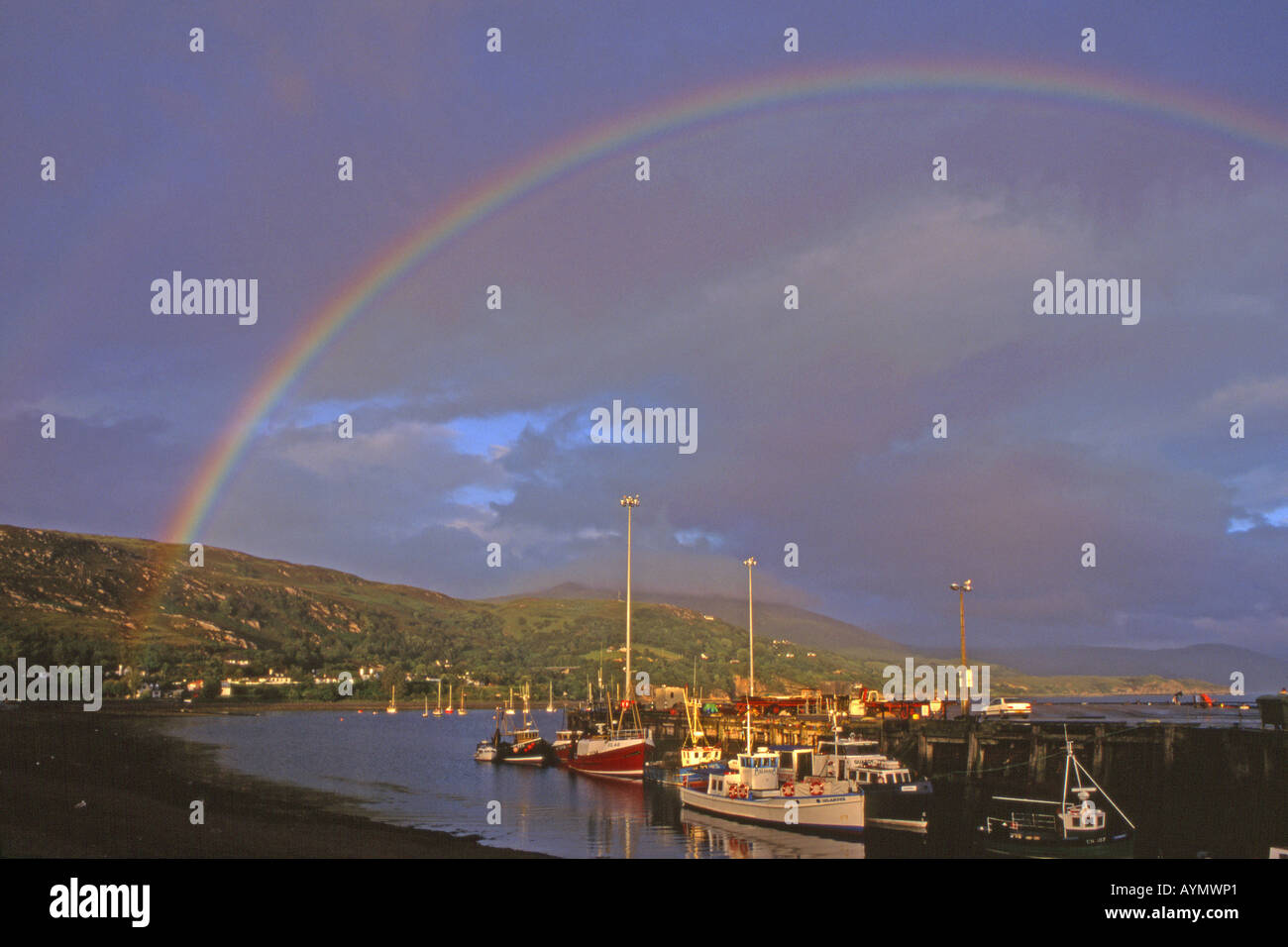 Rainbow over a fishing village in Scotland Stock Photo