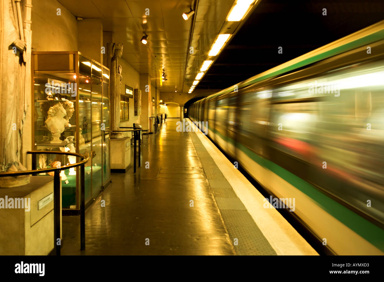 Louvre Rivoli subway station with blured wagons in motion - Paris, France Stock Photo