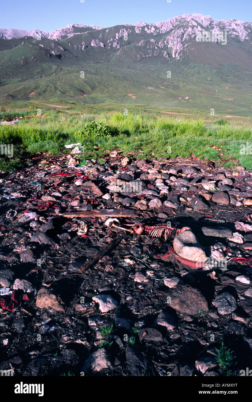 Human remains at a Tibetan sky burial site in the mountains of Langmusi in China's Gansu province. Stock Photo
