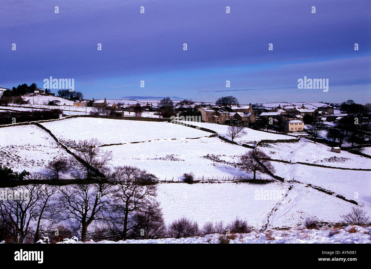 Holme Village in winter snow from Netherley, Holmfirth, Peak District