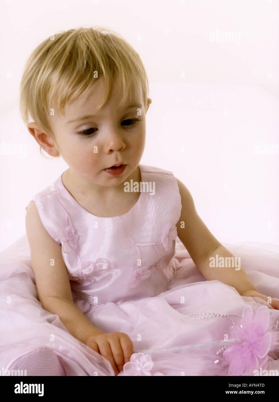 Baby girl in pink party dress Stock Photo - Alamy