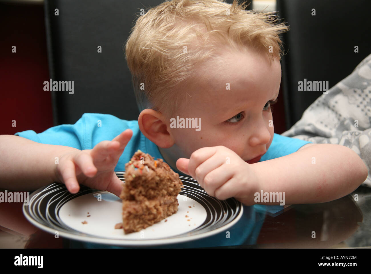 Toddler playing with food Stock Photo