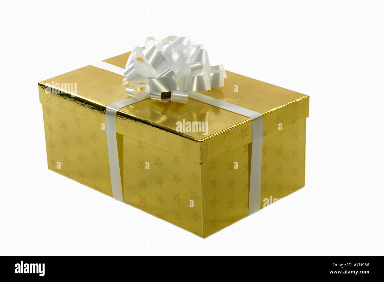 Still life of a gift wrapped present with an ornate white bow isolated on a white background Stock Photo