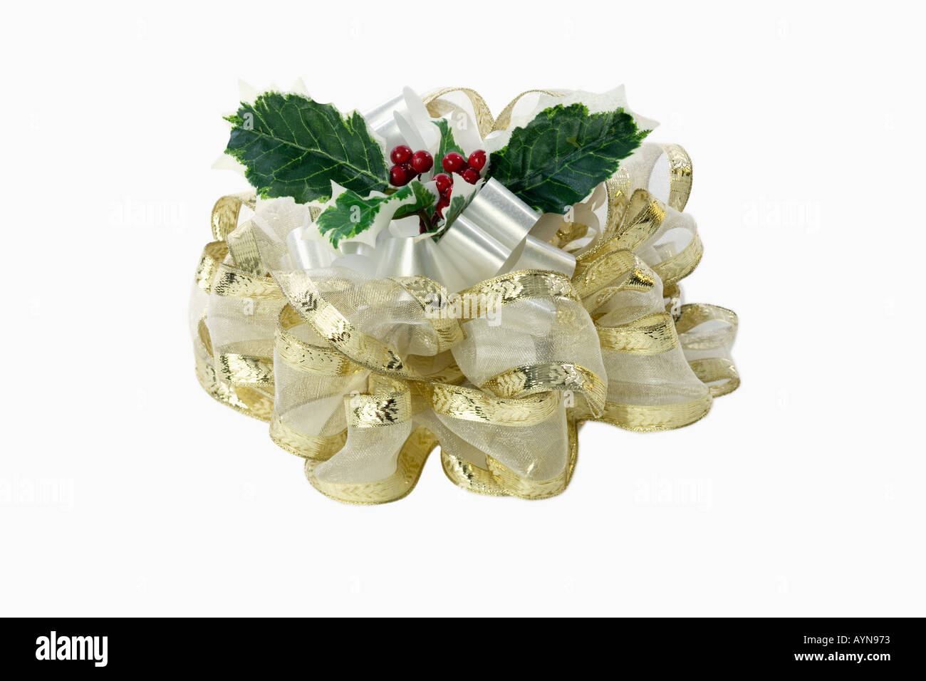 Christmas bow with holly silhouetted on white background Stock Photo