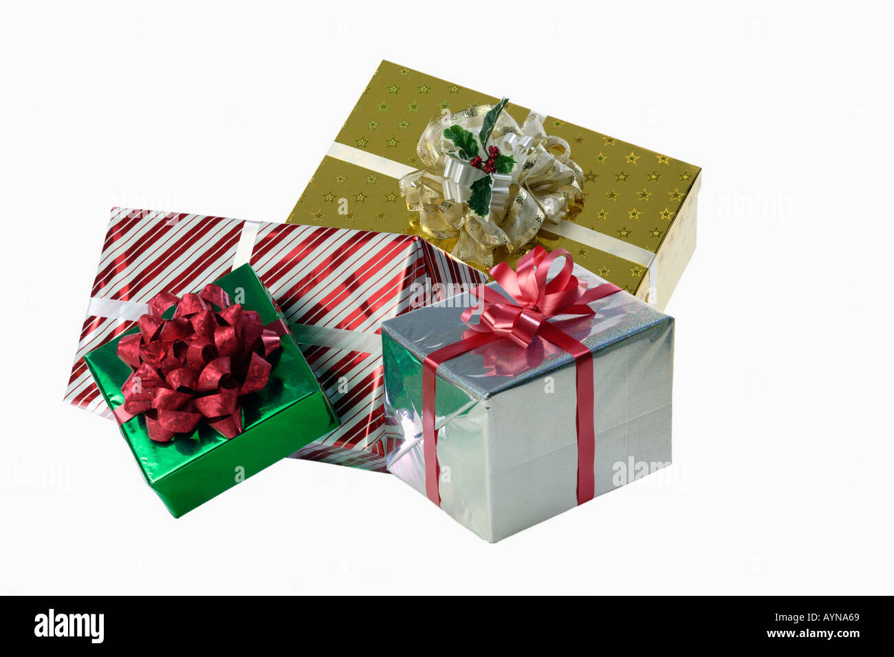 Still life of gift wrapped presents with an ornate bow isolated on a white background Stock Photo
