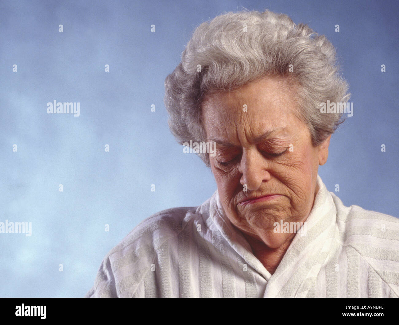 distraught elderly woman with eyes closed Stock Photo - Alamy