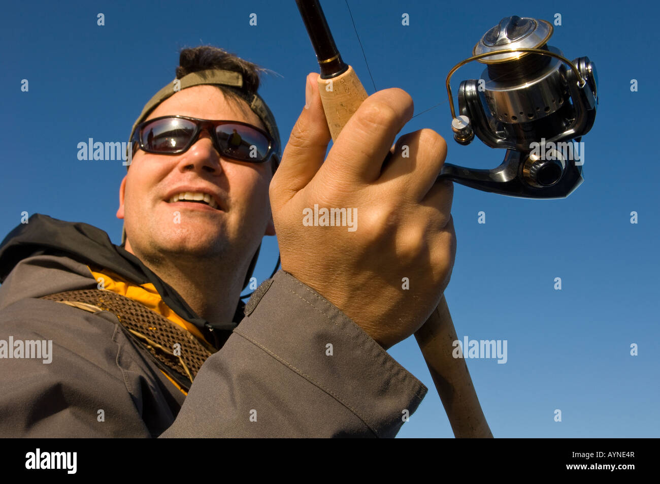 A FISHERMAN CASTS HIS LINE BIG STONE LAKE MINNESOTA SOUTH DAKOTA BORDER