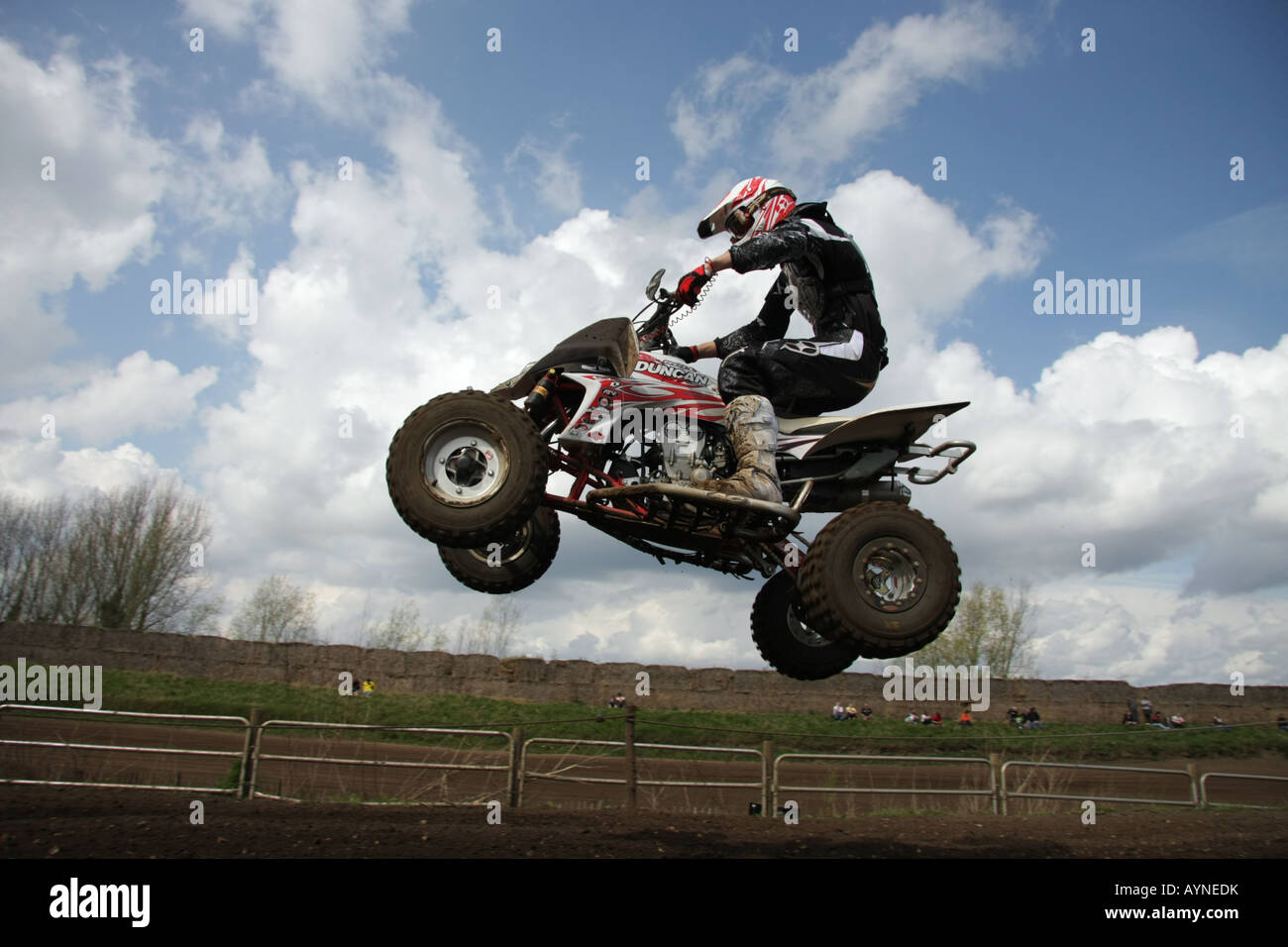 A quad racer clears a tabletop jump at Mildenhall Stock Photo Alamy
