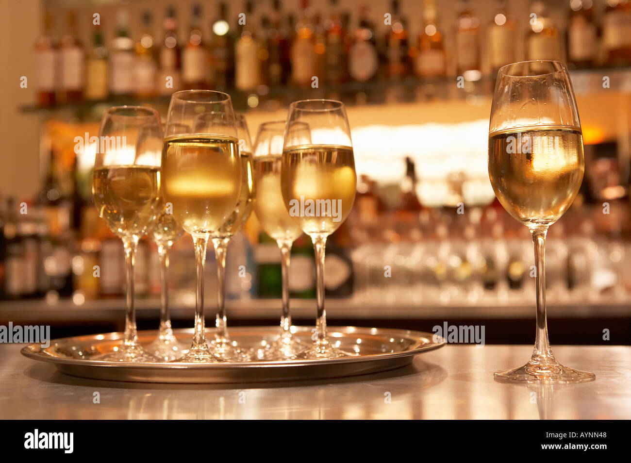 GLASSES OF WHITE WINE ON BAR Stock Photo Alamy