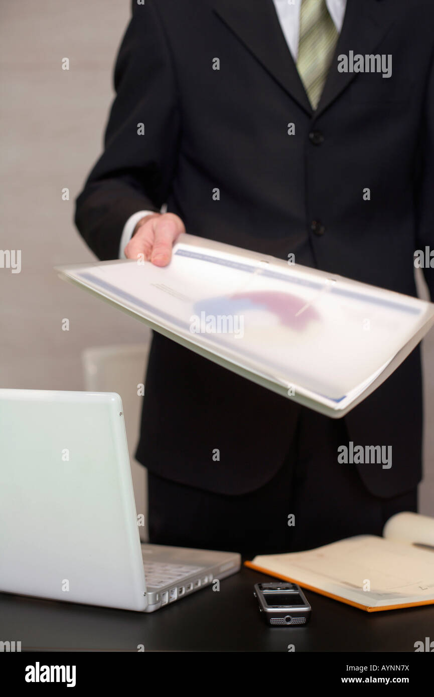 Businessman handing over documents hires stock photography and images