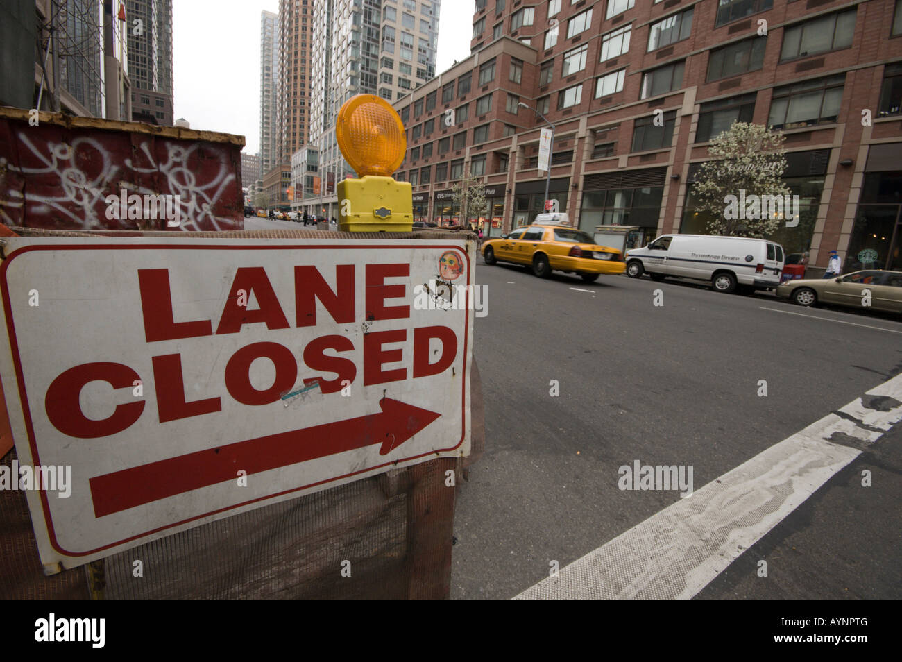 A 'Lane Closed' sign diverts traffic on 6th Avenue in Manhattan Stock Photo
