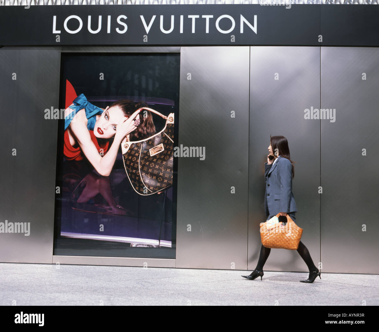 Japan. Louis Vuitton display window with chequered cloth stuffed