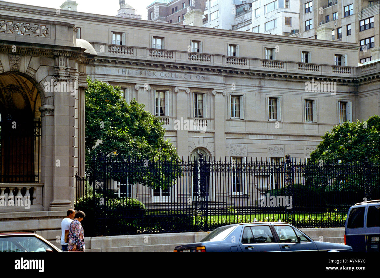 Cars parked in front of one of the city s residences the former home of industrialist Henry Clay Frick which is now a museum housing the Frick Collection Stock Photo