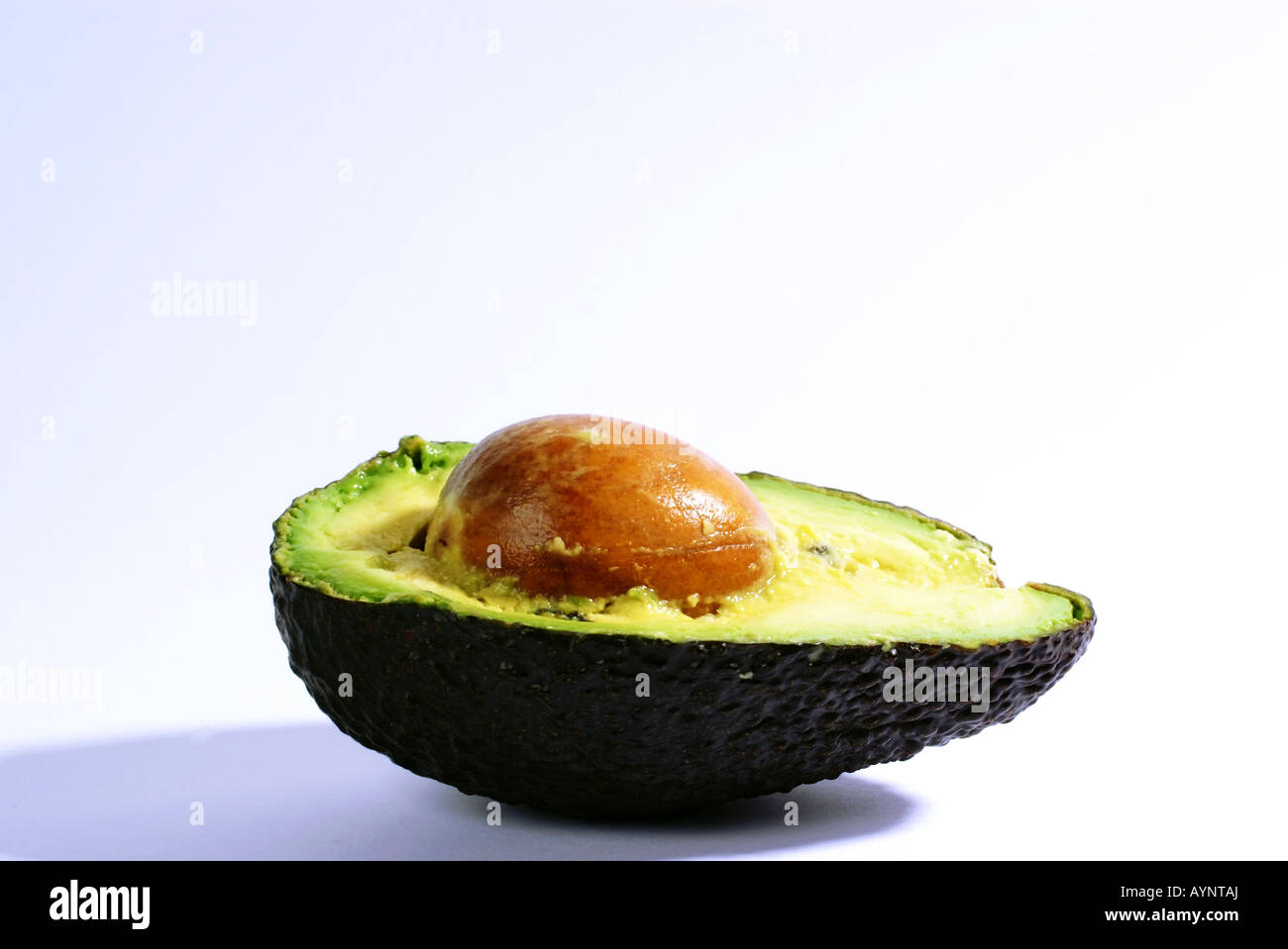 Avocado cut in halves Stock Photo