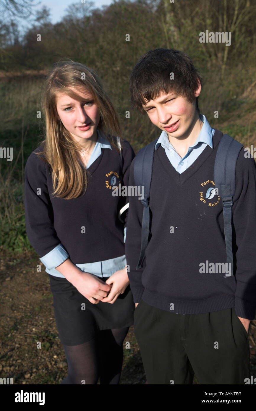 Boy And Girl Teenage Twins In School Uniform Standing In Countryside Stock Photo Alamy